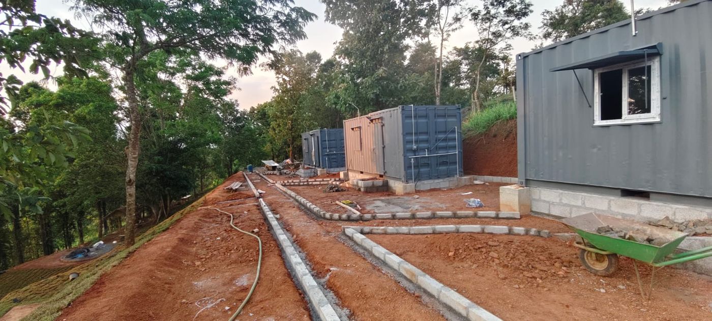 Block edging marking out paths between cabins at dusk
